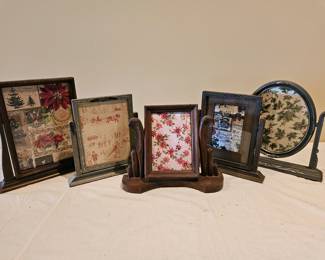 Antique photo frames in stands