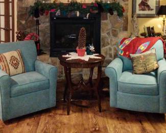 Pair of swivel armchairs and antique round center table