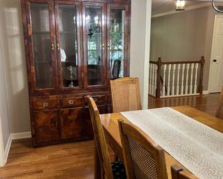 Campaign Style Lighted China Cabinet, Thomasville Dining Table and 8 cane back chairs