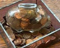 Glass Piggy Bank With Pennies