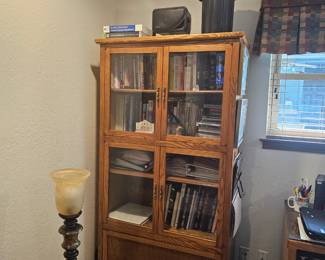One of two glass front book or display units withs torage