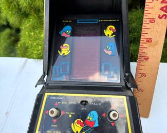 Pac Man Game, plastic cover is loose $20.00