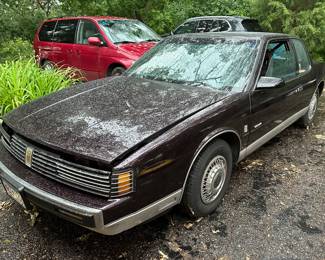 1986 Oldsmobile toronado, 145,000 miles. VIN#1G3EZ57B4GU307853.      $3,995.00  Call 612-462-2293 to make an appointment to view tomorrow June 13 between 9:00 and 2:00 or Saturday morning after 8:30am.  Sorry, we had to photograph in the rain.   It runs, very vew scratches, some rust on the front of hood and hood needs adjusting.  