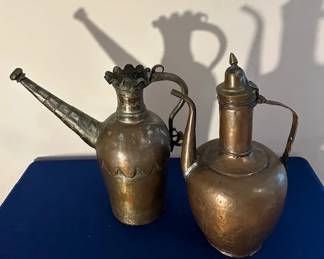 Antique copper pitcher and antique Turkish copper pitcher.