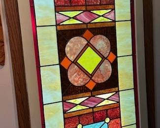 Multi-colored geometric stained glass window, 4'x26".