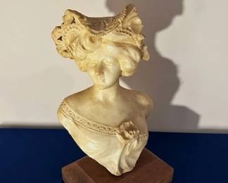 Alabaster bust of a woman.
