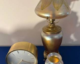 Tiffany & Company Swiss made brass and gold tone quartz desk clock, circa 1976.  Artglass lamp and Orient & Flume pulled feather iridescent studio art glass vase.