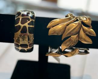Cuffs: Angelique de Paris, silver and resin (L) and Oscar de la Renta (R)
