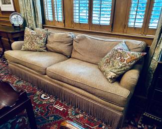 Custom rolled arm sofa with braided rope welt and trim.