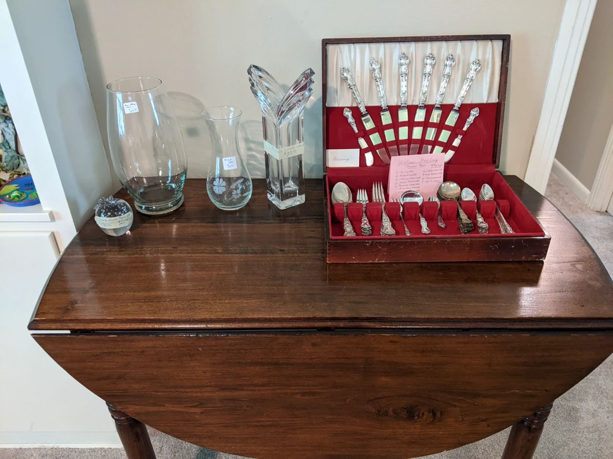Drop leaf table, vases, and Watson Sterling.