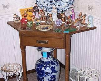Corner table, 19 inch WRS & Co. Imperial Stone platter, 23 inch Oriental vase purchased from Vantines,  Hummels, Royal Doulton, paperweights