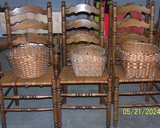 7 ladder back reed bottom chairs (some need restoration)
