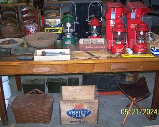 Library table, Coleman lanterns, wood bowls, John Deere thermometer, Mercury oil can and more