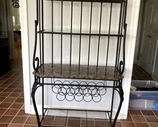Lovely iron baker's rack with nice accents! Wine bottle holder, marble top, glass on shelves