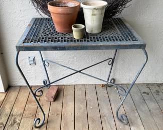 Iron table with antique grate top