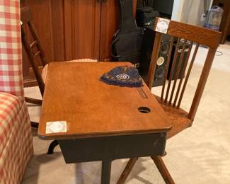 Antique iron base school desk and antique three legged chair on a swivle