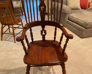 One of a pair of antique Windsor style reproduction arm chairs