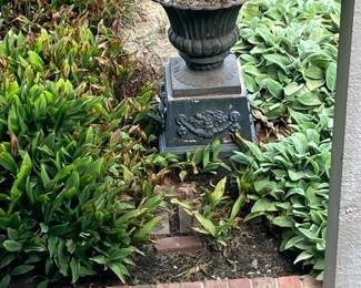 Large iron urn on stand