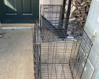 Two large dog kennels