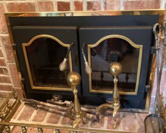 Brass ball andirons and fireplace fender