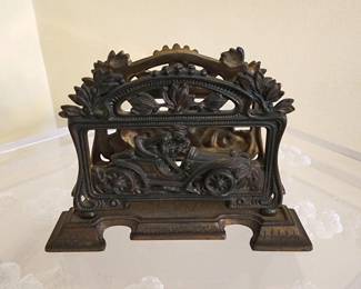 1940'S METAL ART ORNATE LETTER HOLDER. HAS CAR MOTIF. POSSIBLE MADE BY THE B&H COMPANY