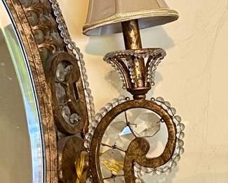 Lovely ornate mirror with affixed paisley sconces.