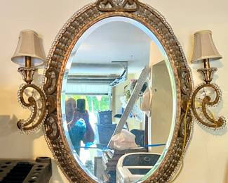 Lovely ornate mirror with affixed paisley sconces.