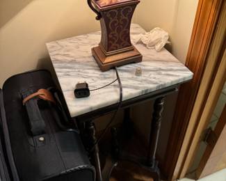 marble accent table // lamp // suitcases