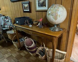 Vintage globe // multiple woven baskets of various styles/sizes/functions// sofa/side table