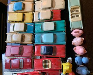 Large assortment of 1950s friction cars, models, plastic and metal. 1940s hard plastic ducks and rabbits -Easter basket toys