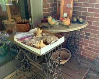Out on the deck; bird collection, shells, tables made from old Singer sewing machines