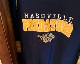 Several Predators jerseys and tee shorts
