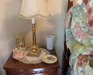 brass lamp, vintage end table, full bed, nice bedding