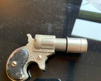 Interesting car lighter, in shape of a pistol