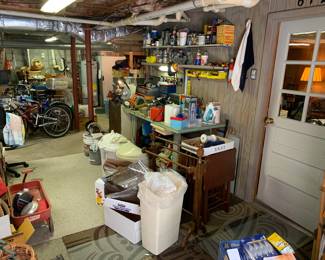 a corner of the garage, lots of small tools, saws, chenicals, several items new in box. Lots of stuff to "pick" here. 