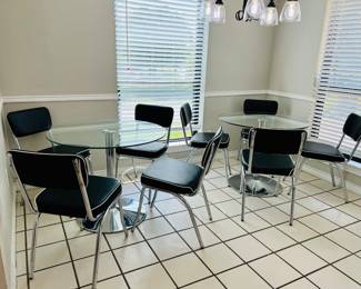 Two glass table each has four chairs. 