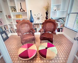 Twin wicker fan arm chairs and upholstered foot stools