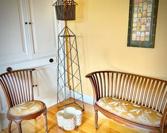 Antique settee and chair (both on wheels) with updated upholstery. Birdhouse sculpture.