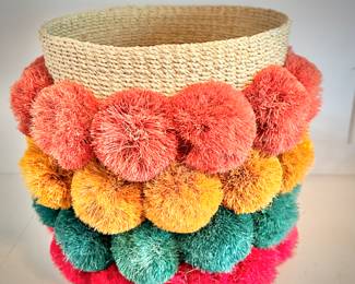 Waste basket with pom poms