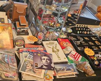 Stamp books, bag of baseball and hockey cards, vintage Polaroid land camera and more!
