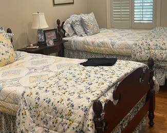 Twin beds with vintage table