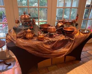Many vintage copper cookware and serving pieces