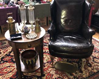 Split leather wingback chair by Kindel, tin lanterns, majolica jardiniere