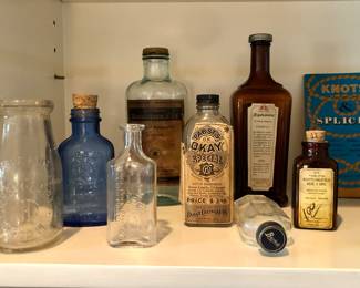 Old medicine bottles + Seattle milk bottle