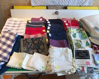 Assorted tablecloths & napkins, kitchen towels