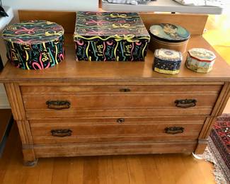 Low antique dresser (42”L, 19”D, 23.5”H + 5” backsplash), Best’s Apparel hat boxes, tins