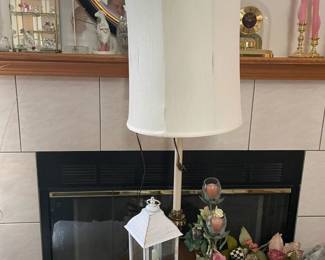 . . .  lamp table, lantern and table lamp -- notice beautiful mirror above fireplace