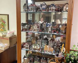 . . . love this full-glass curio cabinet and Department 56 pieces on full display