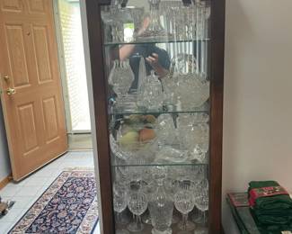 . . . beautiful curio cabinet stuffed with Waterford crystal!!