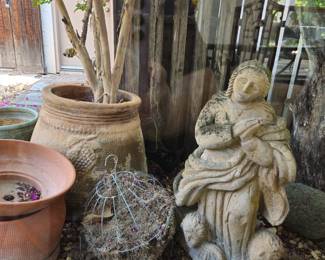 Plant in pot is not for sale. Cement saint is approx. 38" tall.